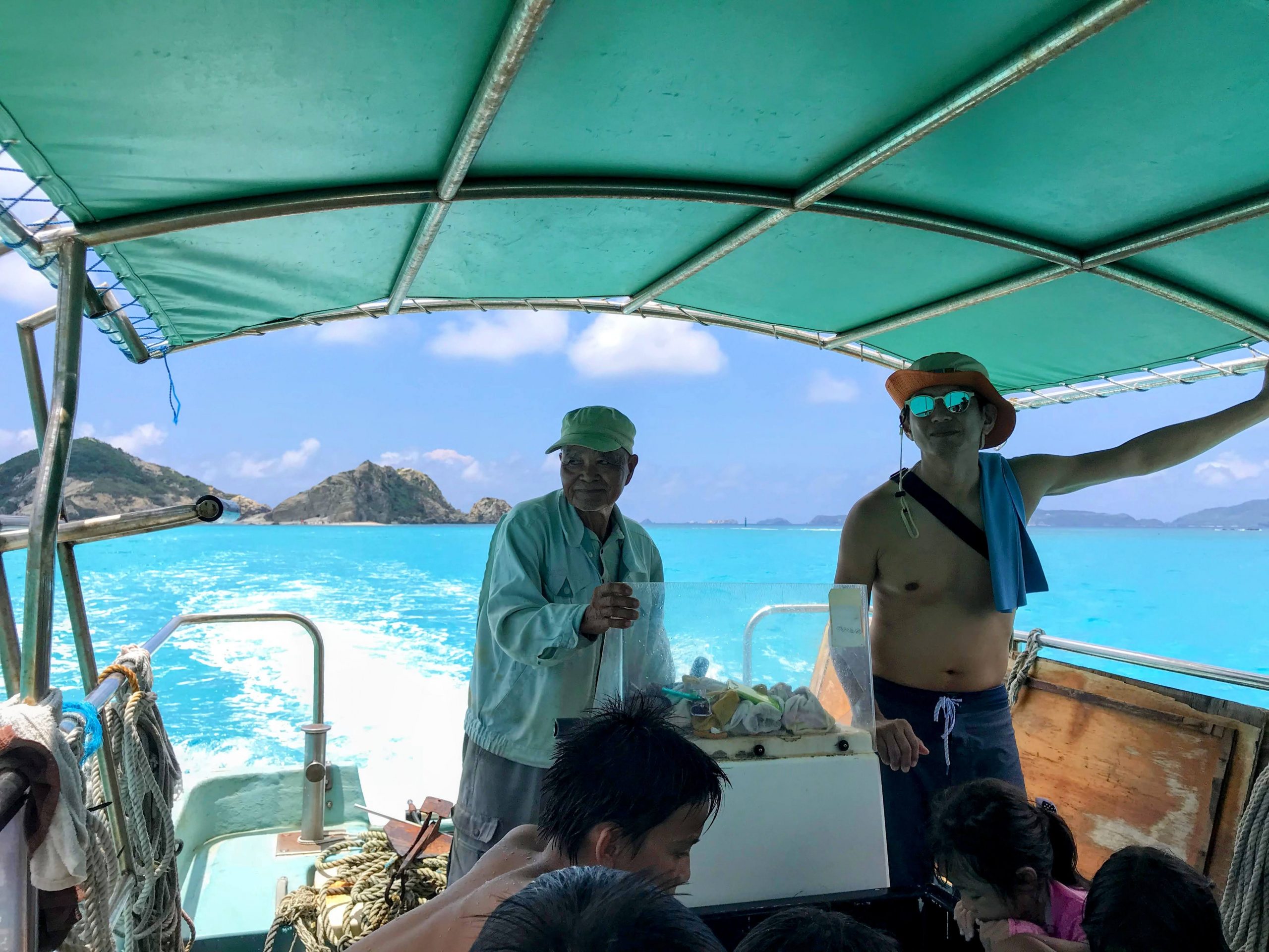 Snorkel boat off Aharen Beach, Tokashiki, over a shallow reef